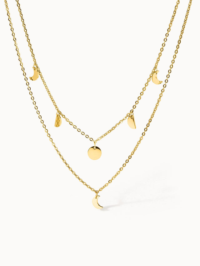 Zweigliedrige PURELEI Luna Kette in 18K Gold mit filigranen Mondanhängern, elegant und feminin gestaltet.