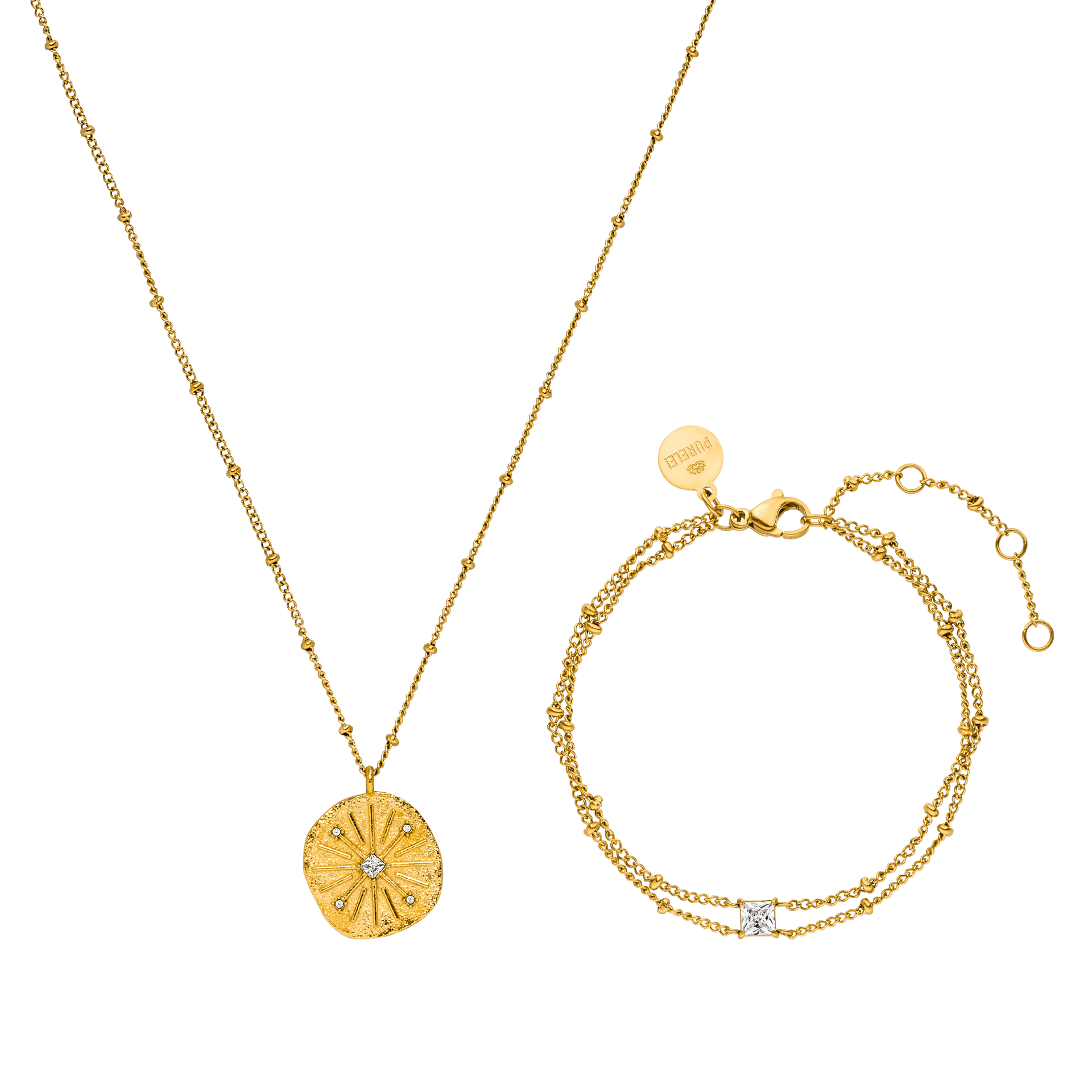 Goldene Kette mit Muschel-Anhänger und Armband, beide von PURELEI, elegant und feminin.