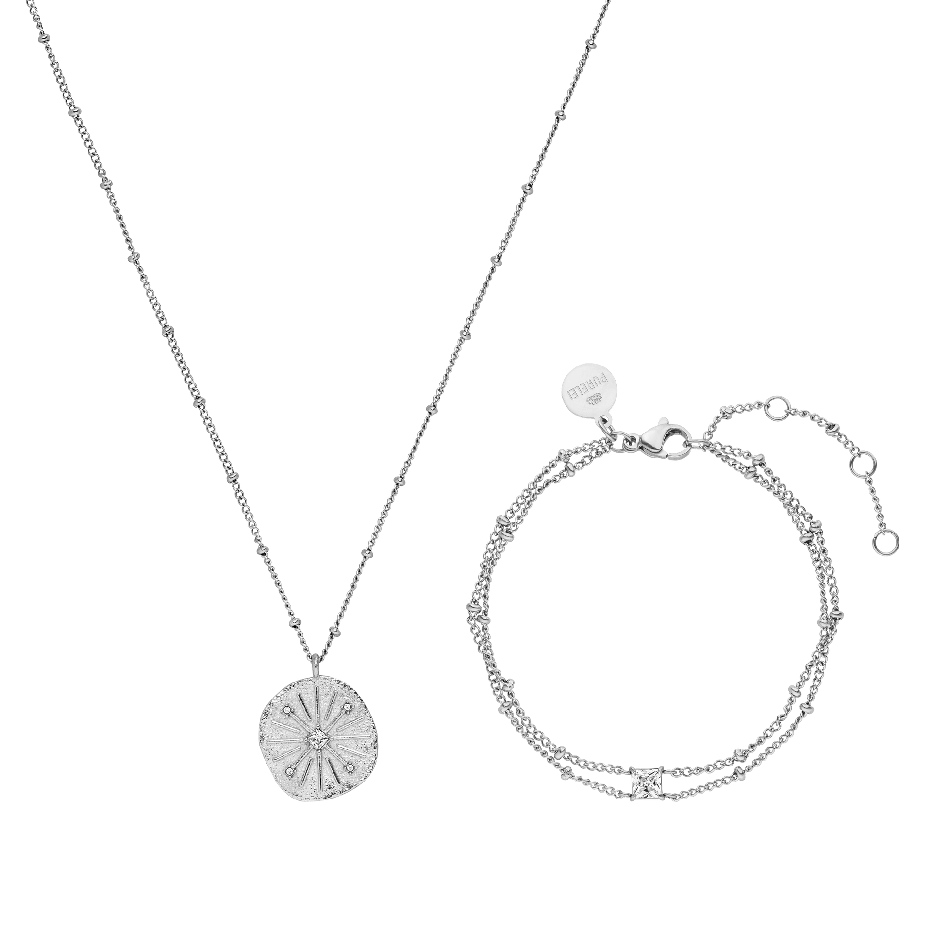 Silberne Kette mit Muschel-Anhänger und passendem Armband von PURELEI, elegant und modern.